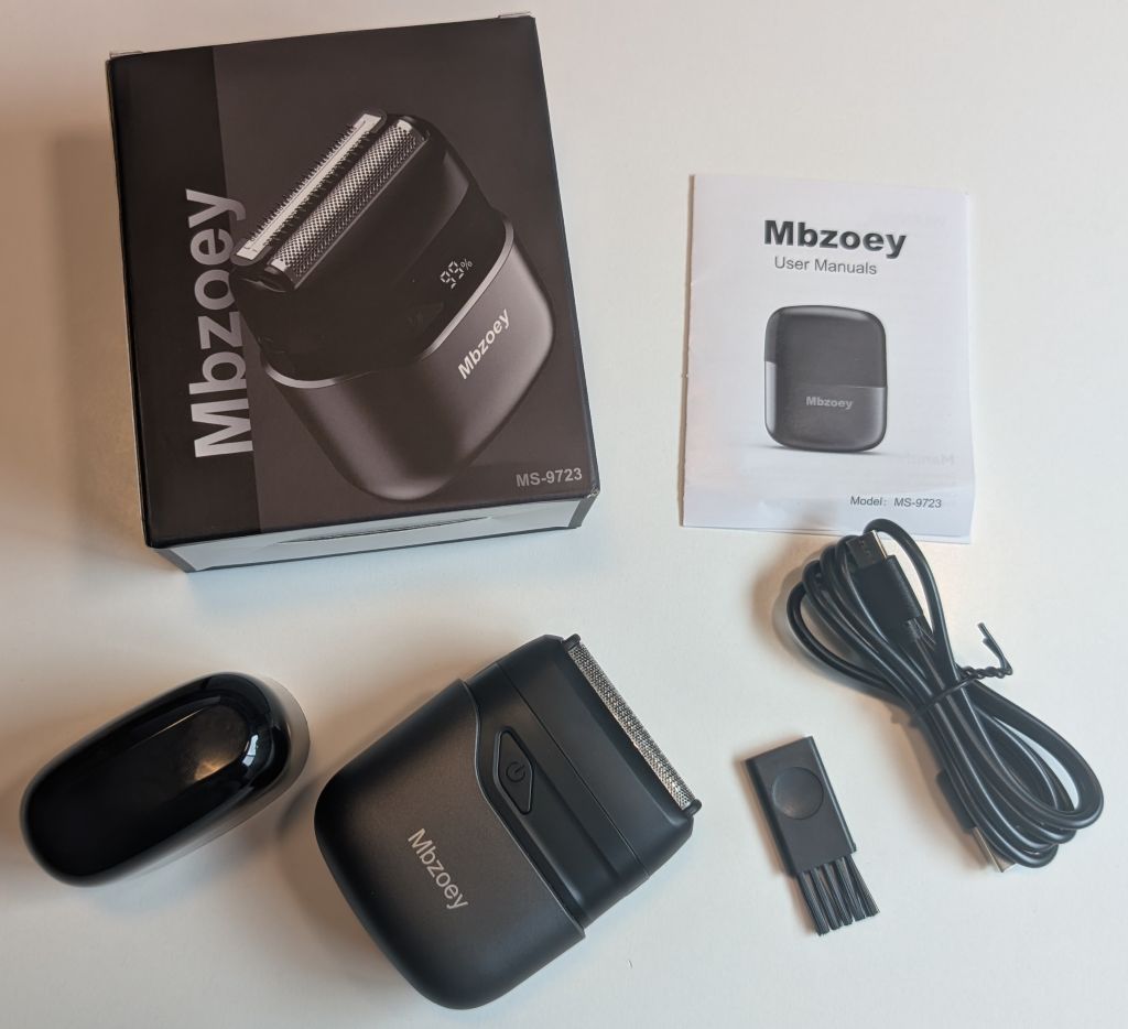 everything in the box of the mbzoey shaver: cord, shaver, brush, docs, shaver cover